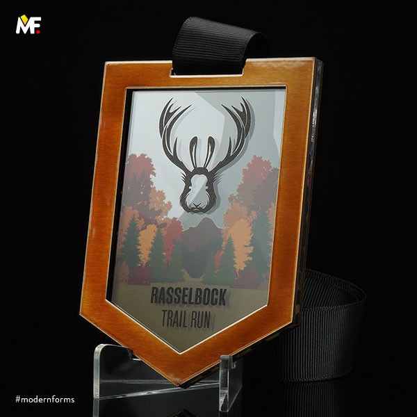Brown steel medal with glass printed trees