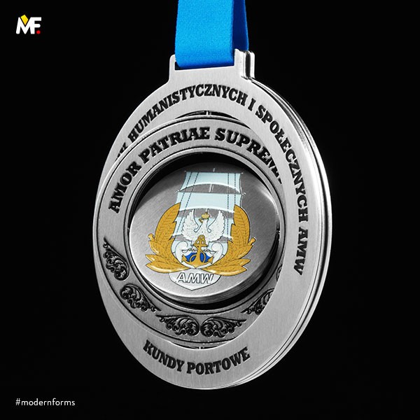 Multi-element medal with moving parts